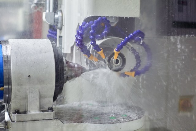 worker inspecting band saw blade8