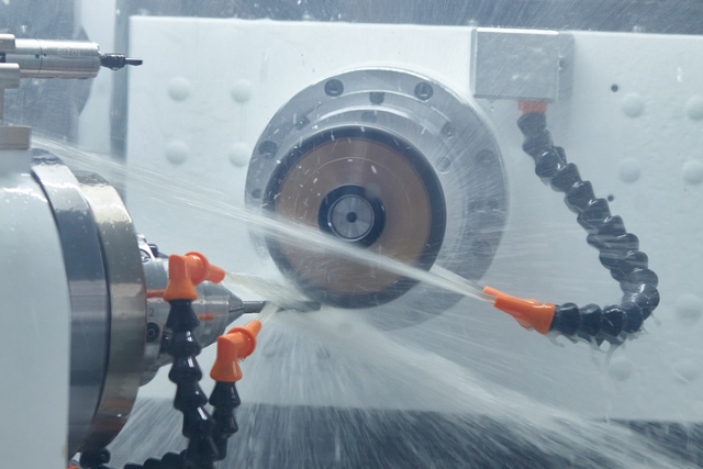 worker inspecting band saw blade13